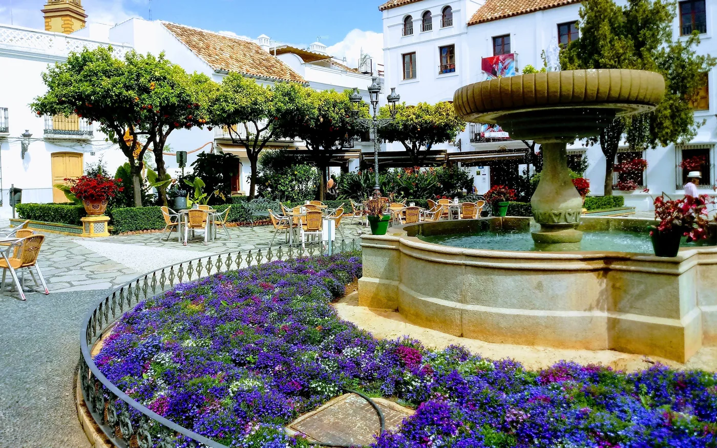 The Plaza de las Flores in Estepona: fountain, orange trees and flower beds